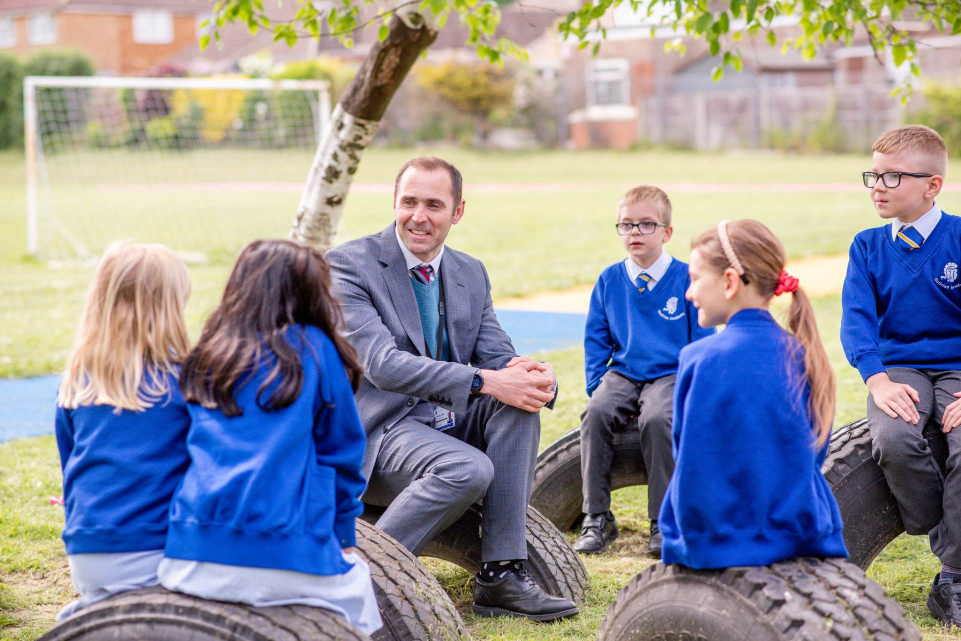 Image of Principal and children